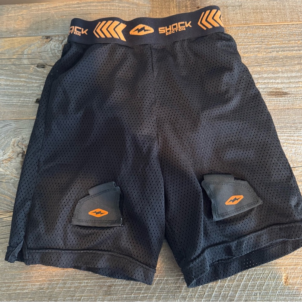 Shock Doctor Black and Orange Athletic Shorts. Hockey shorts.